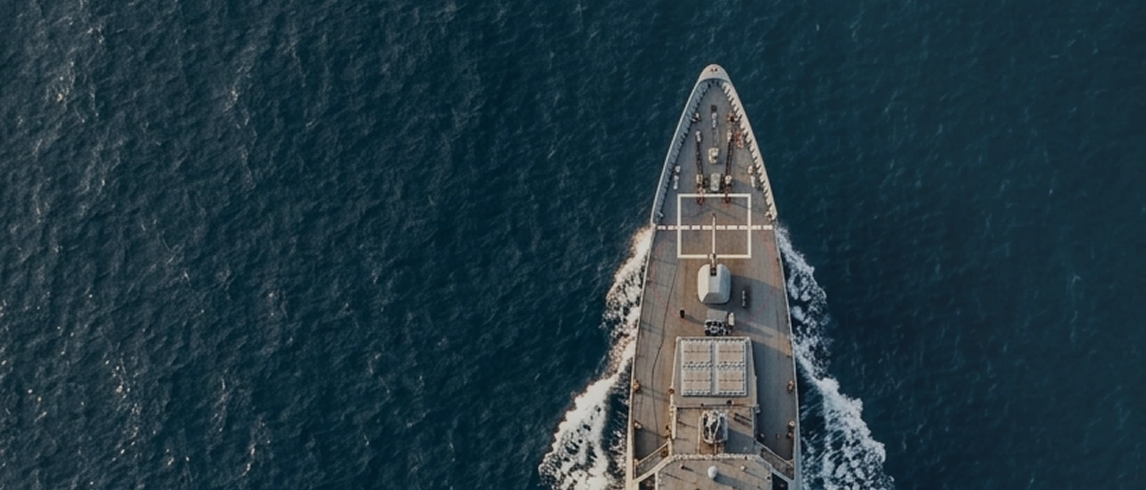 Aerial view of a naval ship in the ocean