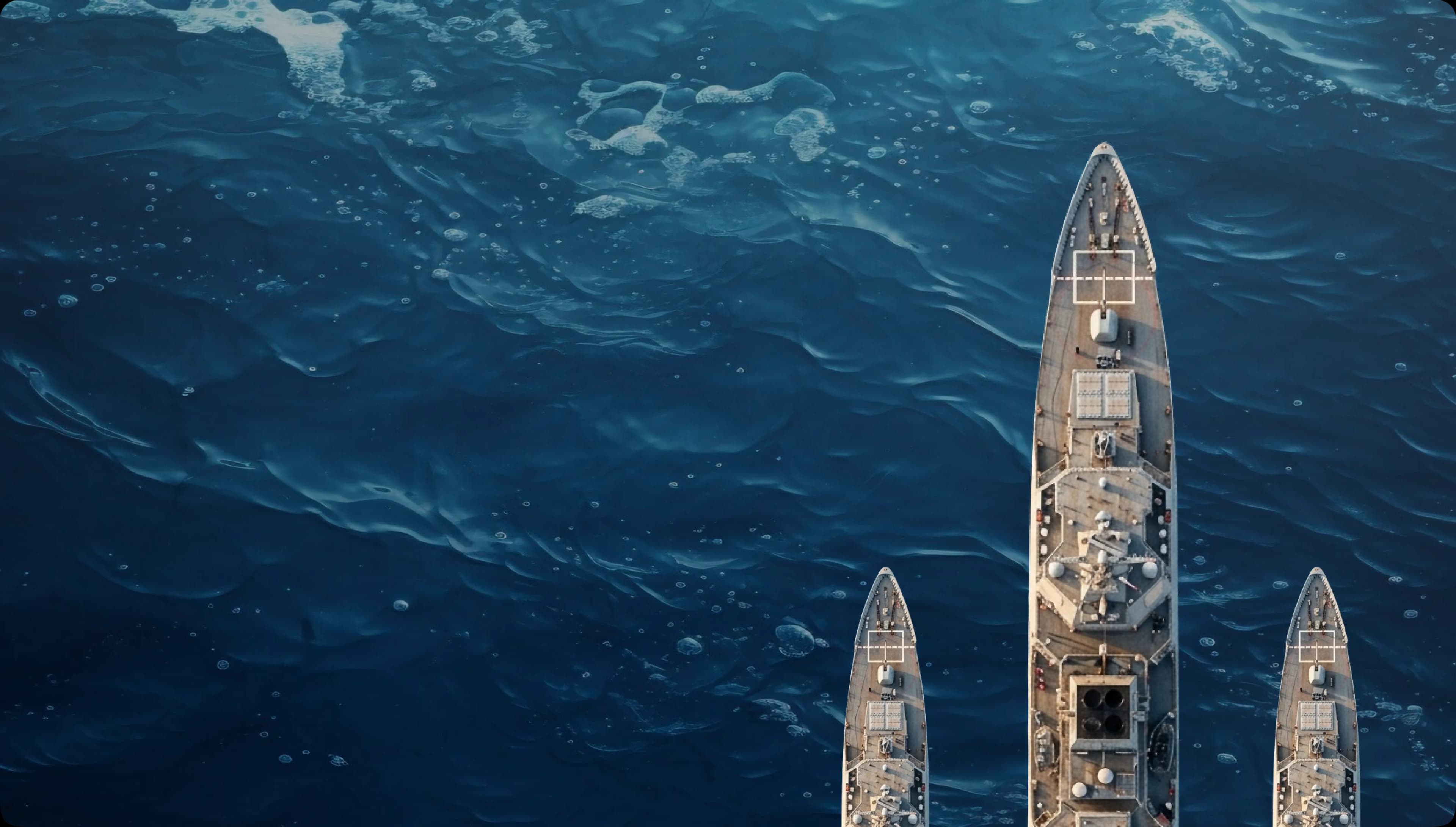 Aerial view of three ships in the ocean